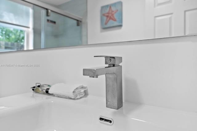 full bathroom featuring a shower with shower door