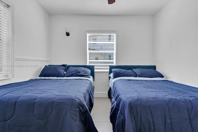 bedroom featuring ceiling fan and carpet floors