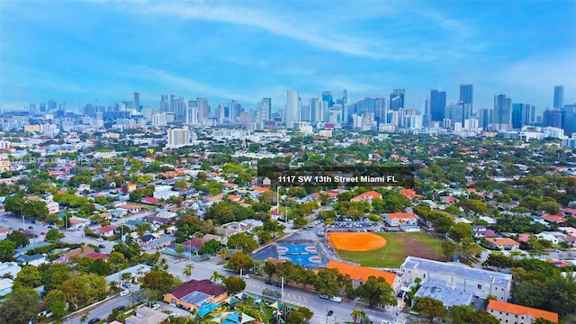 birds eye view of property with a city view