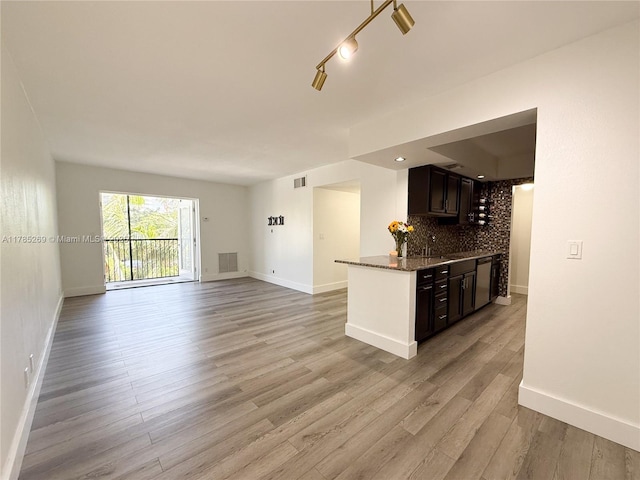 1601 S Flagler Dr Unit 211O, West Palm Beach, FL 33401 - kitchen featuring baseboards, stainless steel dishwasher, visible vents, and backsplash