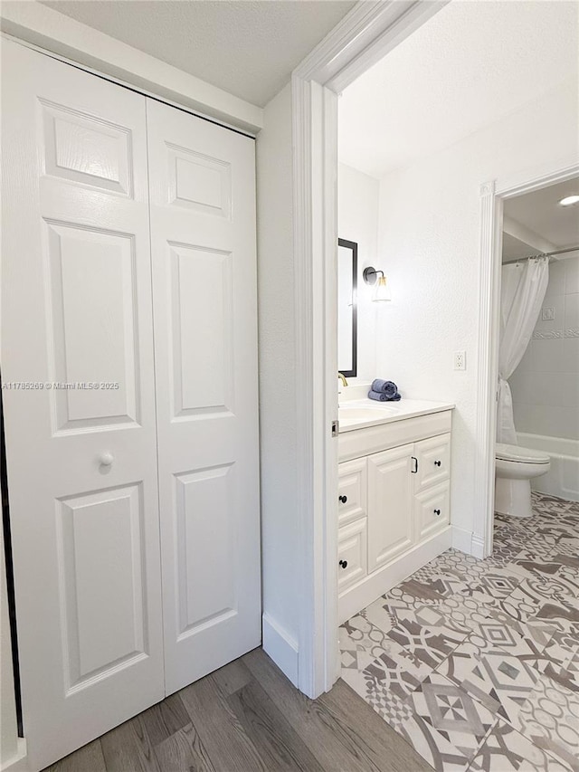 1601 S Flagler Dr Unit 211O, West Palm Beach, FL 33401 - full bathroom with toilet, vanity, and baseboards