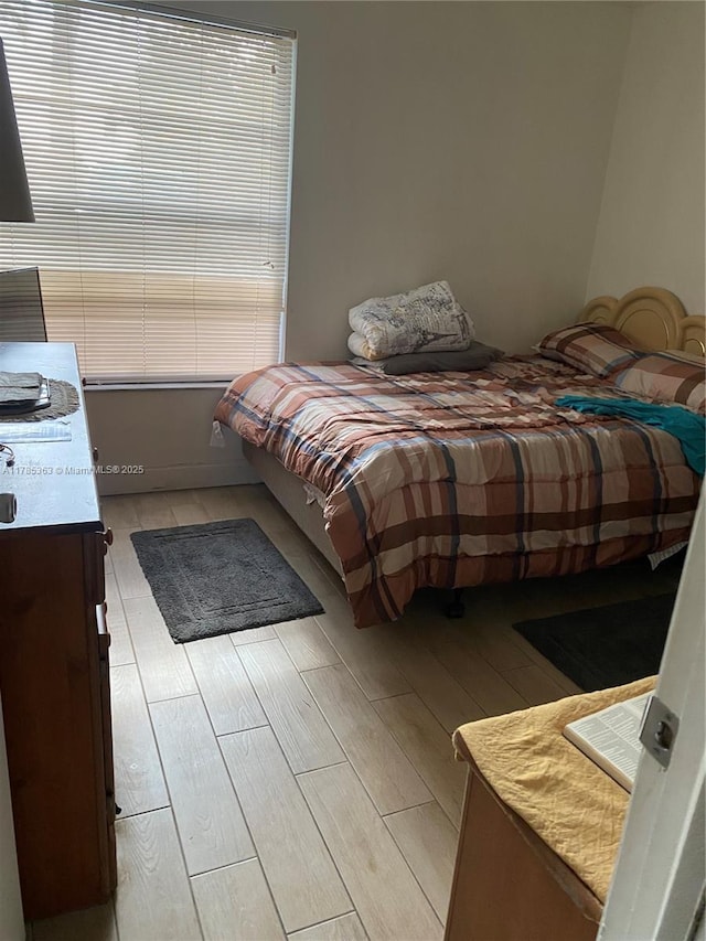 202 Lake Pointe Dr Unit 105, Oakland Park, FL 33309 - bedroom featuring light wood-style flooring