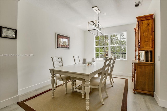 4322 Fox Ridge Dr, Weston, FL 33331 - dining room featuring baseboards and light wood finished floors