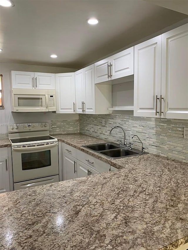 1810 W 56th St Unit 3127, Hialeah, FL 33012 - kitchen featuring white appliances, a sink, white cabinetry, recessed lighting, and backsplash