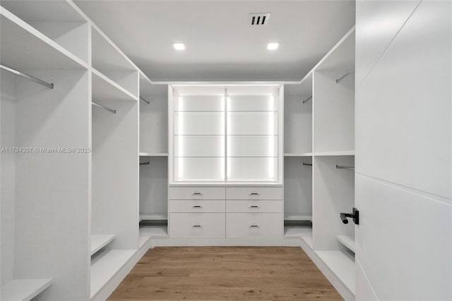 spacious closet with visible vents and wood finished floors