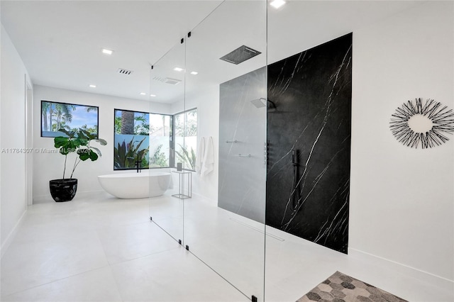 full bath featuring recessed lighting, a marble finish shower, visible vents, and a soaking tub