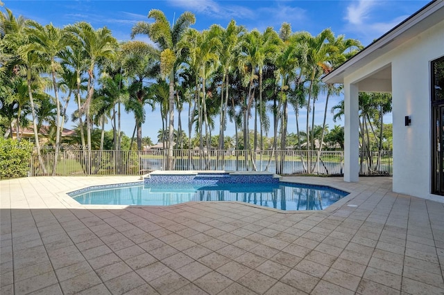 view of swimming pool featuring a jacuzzi, a fenced in pool, a patio area, a water view, and a fenced backyard