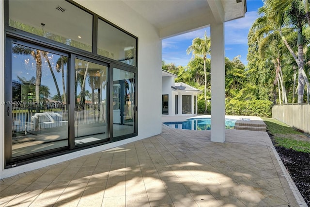 view of swimming pool with a fenced in pool and a patio area