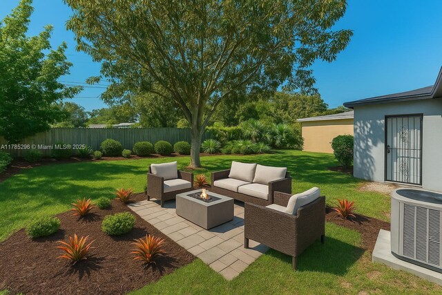 view of patio featuring central AC, fence, and an outdoor living space with a fire pit