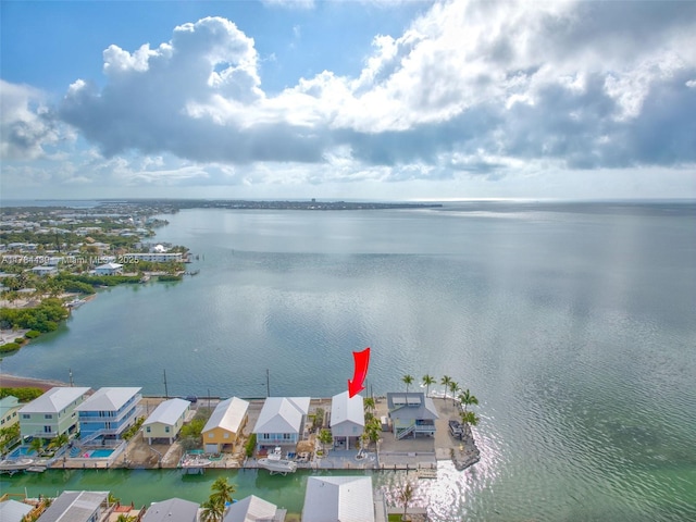 aerial view featuring a water view and a residential view