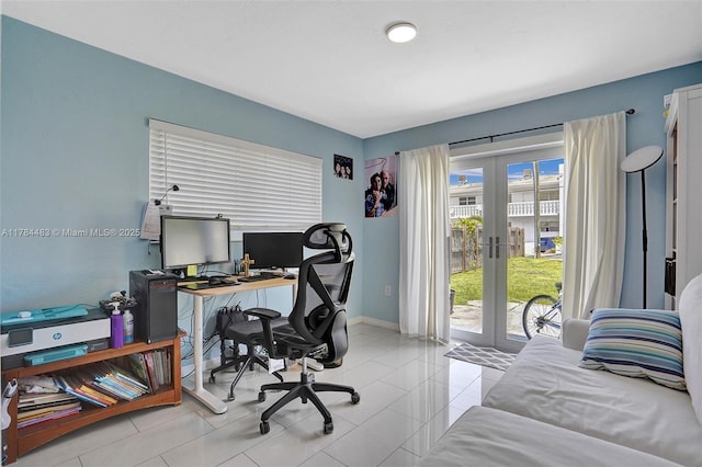 office featuring french doors, light tile patterned floors, and baseboards