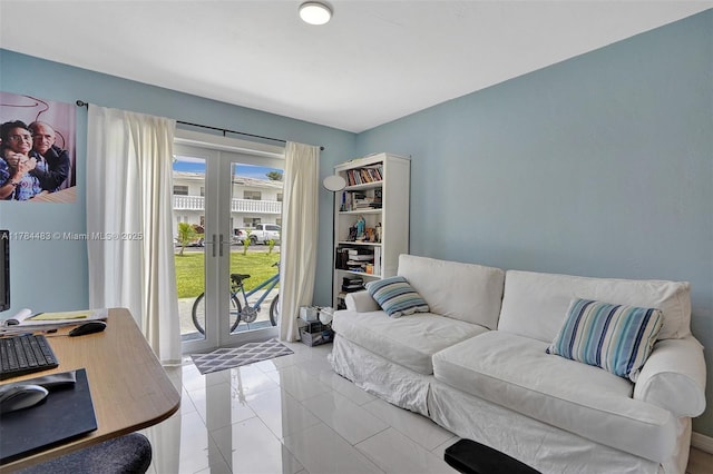 living area featuring french doors and light tile patterned floors