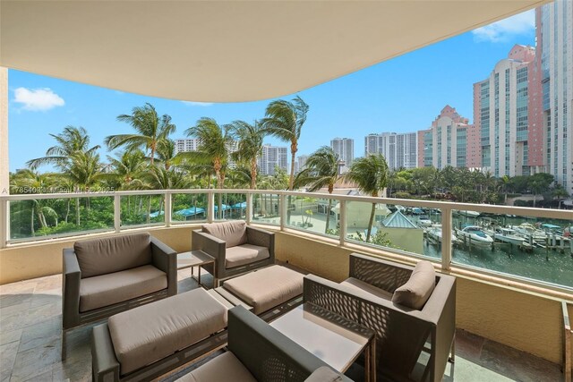 3340 NE 190th St Unit 504, Aventura, FL 33180 - balcony featuring an outdoor hangout area, a view of city, and a water view