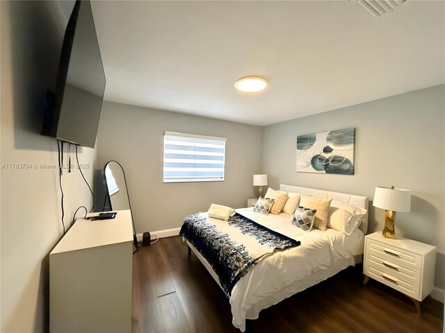 1398 Harbor View Dr, Fort Myers, FL 33917 - bedroom with baseboards and dark wood-style floors