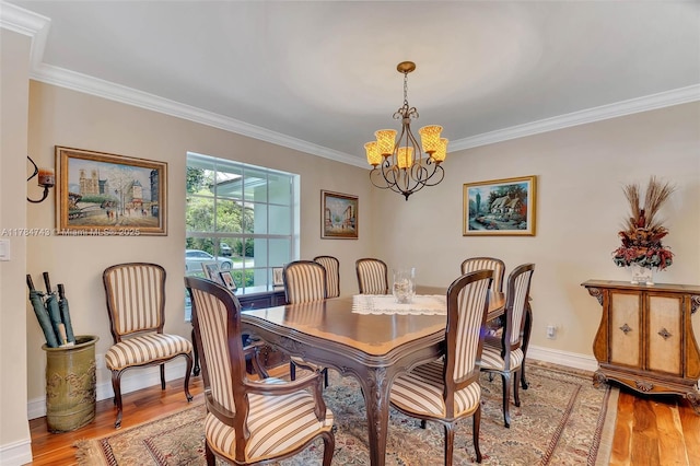 15801 SW 77th Ct, Palmetto Bay, FL 33157 - dining room featuring ornamental molding, a chandelier, light wood-type flooring, and baseboards