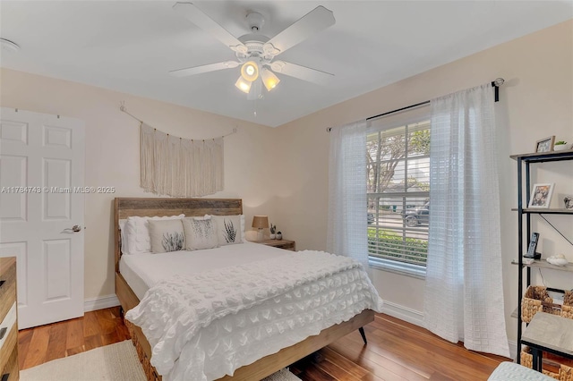 15801 SW 77th Ct, Palmetto Bay, FL 33157 - bedroom featuring multiple windows, wood finished floors, baseboards, and ceiling fan