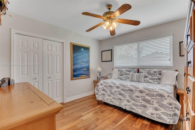 15801 SW 77th Ct, Palmetto Bay, FL 33157 - bedroom with a closet, light wood-type flooring, baseboards, and ceiling fan