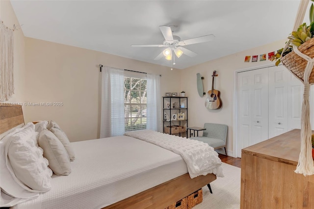 15801 SW 77th Ct, Palmetto Bay, FL 33157 - bedroom with a closet, wood finished floors, and ceiling fan