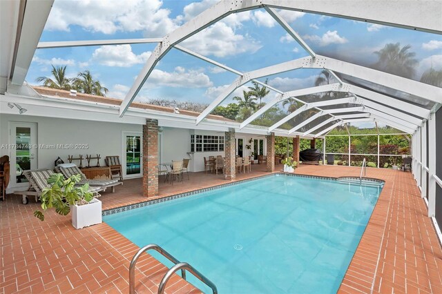 15801 SW 77th Ct, Palmetto Bay, FL 33157 - outdoor pool featuring a patio, outdoor dining space, outdoor lounge area, and a lanai