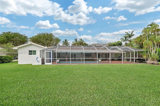 15801 SW 77th Ct, Palmetto Bay, FL 33157 - rear view of property featuring a lawn, glass enclosure, and an outdoor pool