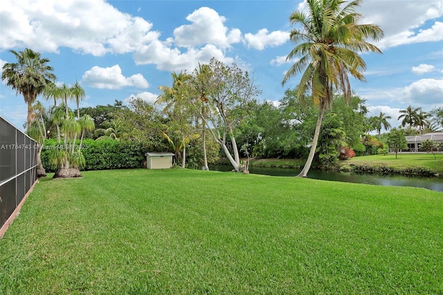 15801 SW 77th Ct, Palmetto Bay, FL 33157 - view of green lawn with a water view and a lanai