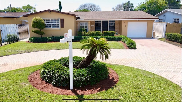 ranch-style home with fence, decorative driveway, and stucco siding