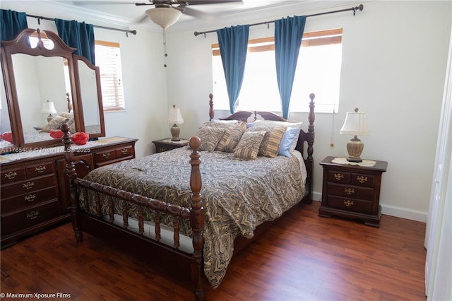 bedroom with dark wood-style floors, baseboards, ornamental molding, and a ceiling fan