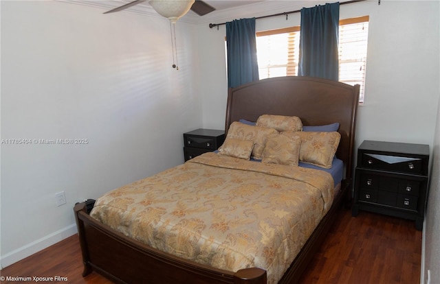 bedroom featuring ornamental molding, baseboards, and wood finished floors