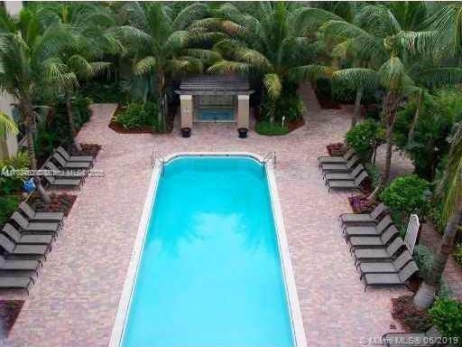 1919 Van Buren St Unit 520A, Hollywood, FL 33020 - community pool featuring a patio