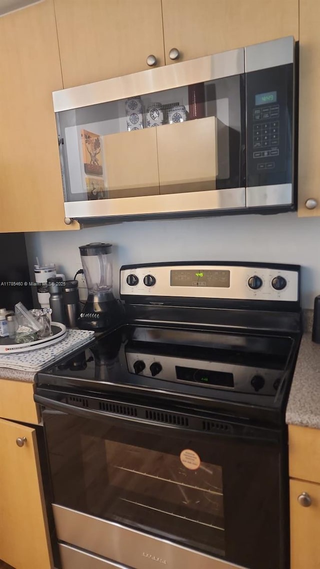 1919 Van Buren St Unit 520A, Hollywood, FL 33020 - kitchen view of appliances with stainless steel finishes and light countertops