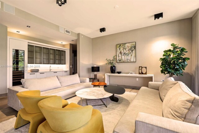 3581 E Glencoe St Unit 309, Miami, FL 33133 - living area with light wood finished floors