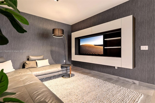 3581 E Glencoe St Unit 309, Miami, FL 33133 - home theater featuring wallpapered walls and wood finished floors