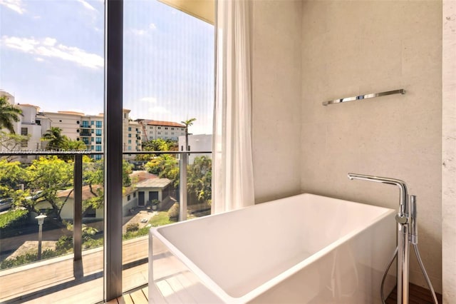 3581 E Glencoe St Unit 309, Miami, FL 33133 - full bathroom with a freestanding bath