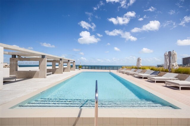3581 E Glencoe St Unit 309, Miami, FL 33133 - community pool featuring a patio area