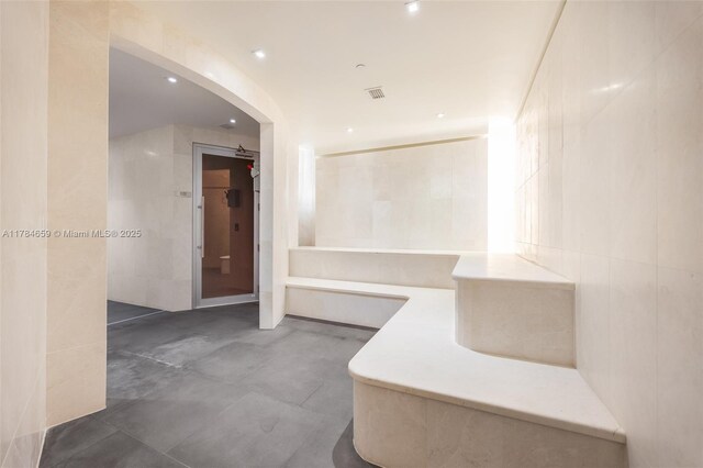 3581 E Glencoe St Unit 309, Miami, FL 33133 - corridor with arched walkways and recessed lighting