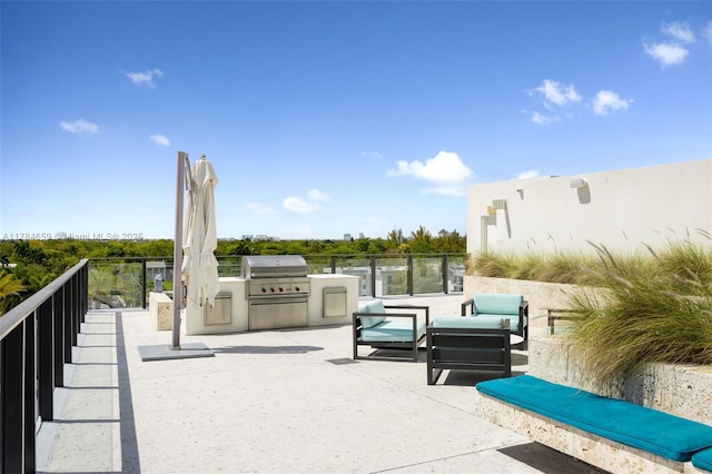 3581 E Glencoe St Unit 309, Miami, FL 33133 - view of patio with exterior kitchen, an outdoor living space, and grilling area