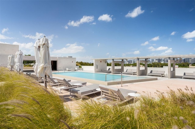 3581 E Glencoe St Unit 309, Miami, FL 33133 - community pool featuring a patio