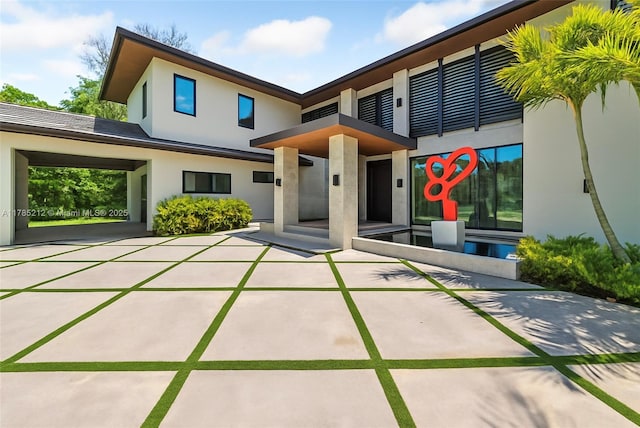 8825 SW 64th Ct, Pinecrest, FL 33156 - back of house featuring stucco siding
