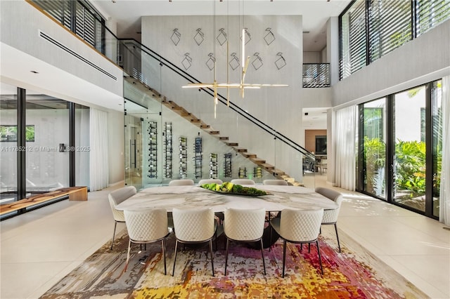 8825 SW 64th Ct, Pinecrest, FL 33156 - dining area featuring a towering ceiling and stairs