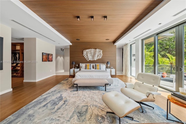 8825 SW 64th Ct, Pinecrest, FL 33156 - bedroom featuring wooden ceiling, access to outside, wood finished floors, and baseboards