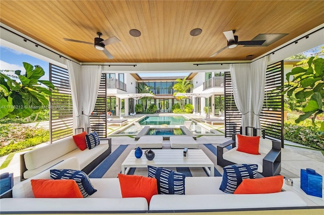 view of patio featuring an outdoor pool, an outdoor hangout area, a ceiling fan, and an in ground hot tub