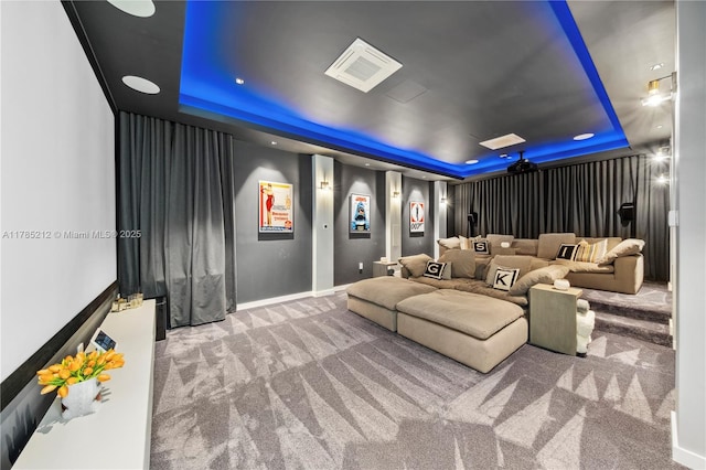 8825 SW 64th Ct, Pinecrest, FL 33156 - carpeted home theater room featuring a tray ceiling and baseboards