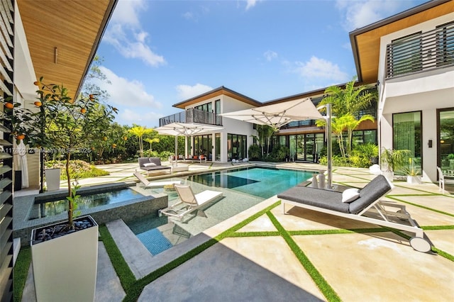8825 SW 64th Ct, Pinecrest, FL 33156 - view of swimming pool featuring a patio and a pool with connected hot tub