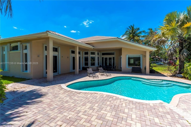 view of pool featuring a patio area and a fenced in pool