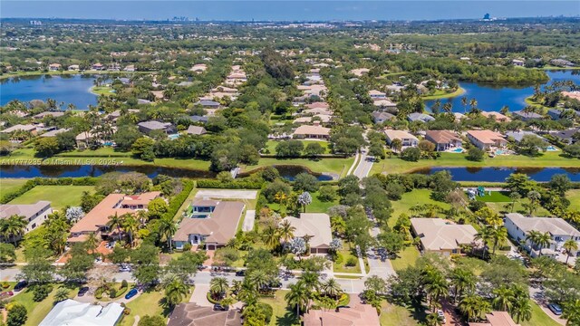 drone / aerial view with a water view and a residential view