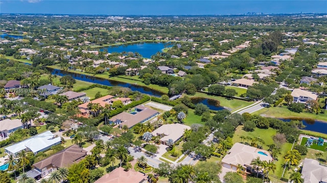 birds eye view of property featuring a residential view and a water view