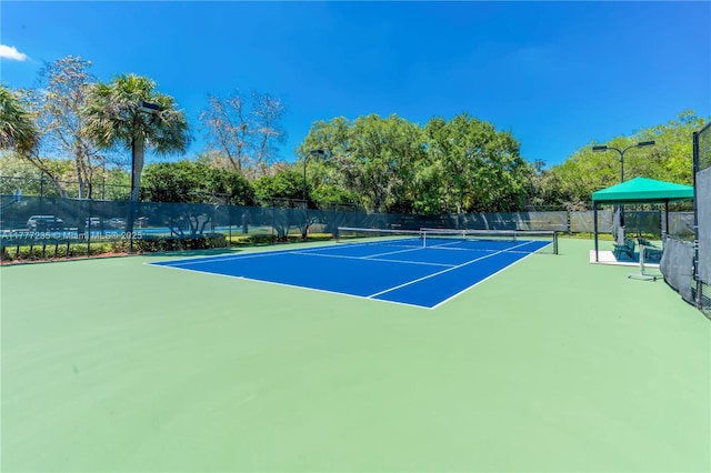 view of sport court with fence