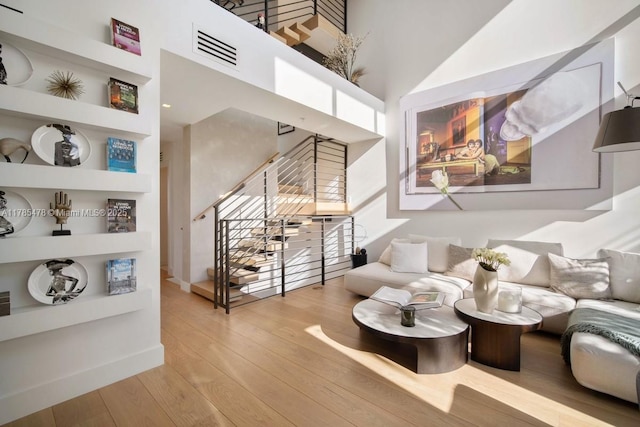 65 N Shore Dr Unit 31C, Miami Beach, FL 33141 - wine area with hardwood / wood-style floors, a high ceiling, and built in shelves