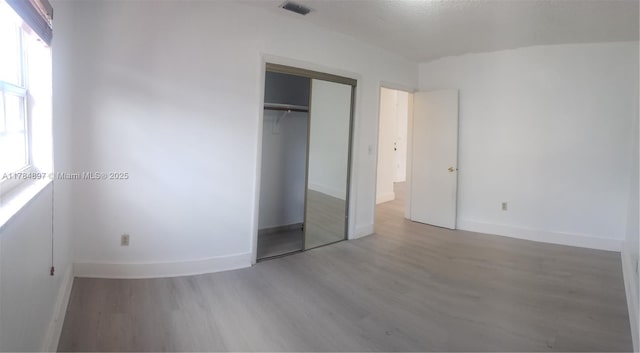 3130 SW 65th Ave, Miami, FL 33155 - unfurnished bedroom with wood finished floors and a closet