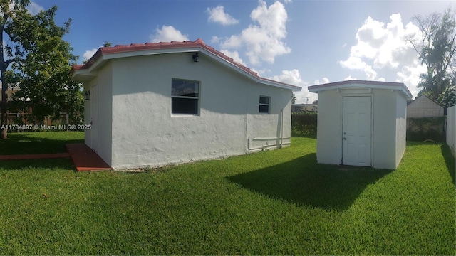 3130 SW 65th Ave, Miami, FL 33155 - view of side of property featuring stucco siding, a shed, and a tiled roof